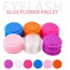 100 colorful flower-shaped disposable glue holders for eyelash extensions — hygienic, fun, and mess-free adhesive control tools.