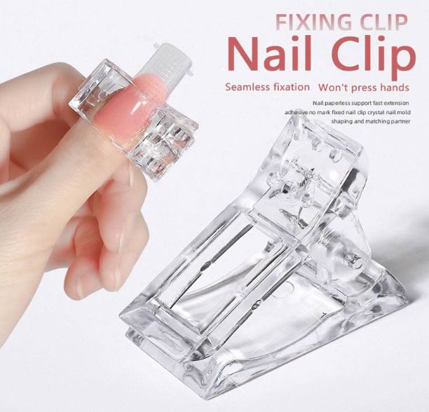 Reusable nail tips clip holding dual form in place during Polygel curing – salon nail extension tool by Luscious Glances.
